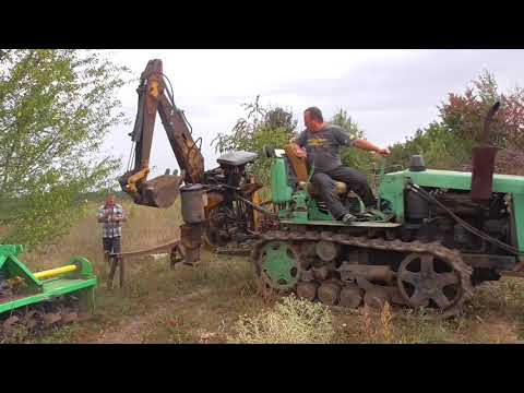 Видео: Трактор Т 54В і екскаватор Бобкат