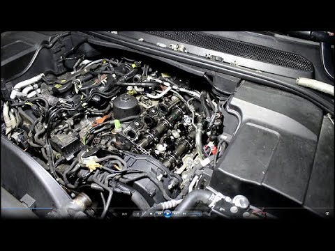 Видео: Замена теплообменника крышки клапанов и свечей накала на Land Rover Discovery 4  3,0  2009 2часть