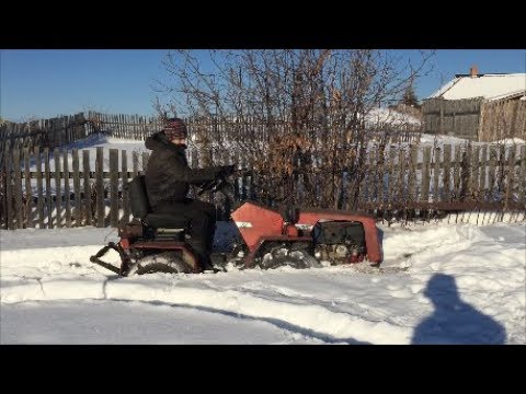 Видео: Проходимость минитрактора беларус 132Н по снегу.