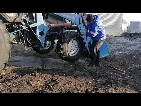 Видео: Замена переднего колеса на МТЗ 82