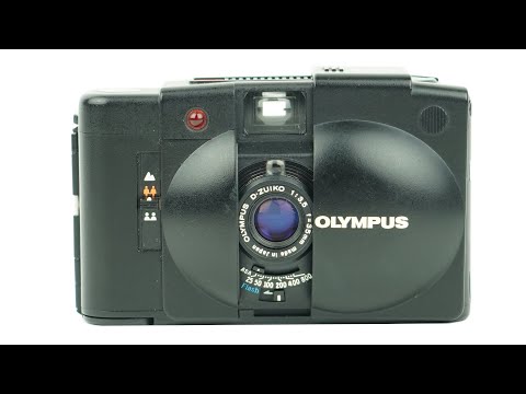 Видео: Как использовать 35-мм пленочную камеру Olympus XA2