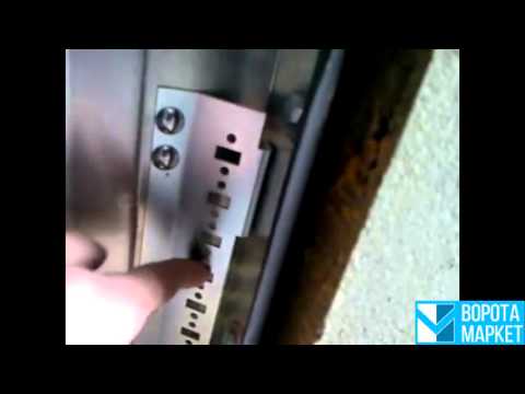 Видео: Монтаж пружины растяжения на секционных воротах ALUTECH серии Standard