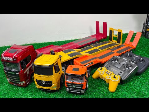 Видео: Распаковка радиоуправляемого грузовика с прицепом, прицепа, контейнеровоза, самосвала, экскаватора