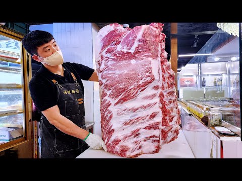 Видео: Удивительные гигантские говяжьи рёбра на углях, жареная 1++ корейская говядина, рёбра с чесноком