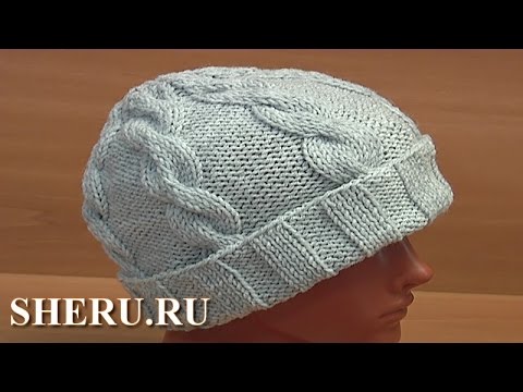 Видео: Шапка с косами и помпоном Урок 56 часть 1 из 2 Вязание спицами