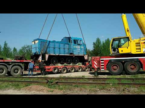 Видео: Погрузка тепловоза ТГМ 23 немецким автокраном на трал! 45 тонн против 130 тонн!