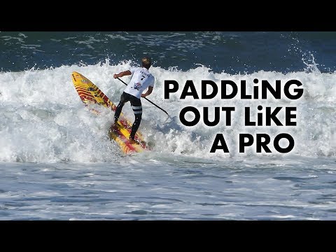 Видео: Как грести на доске с веслом при сильном прибое