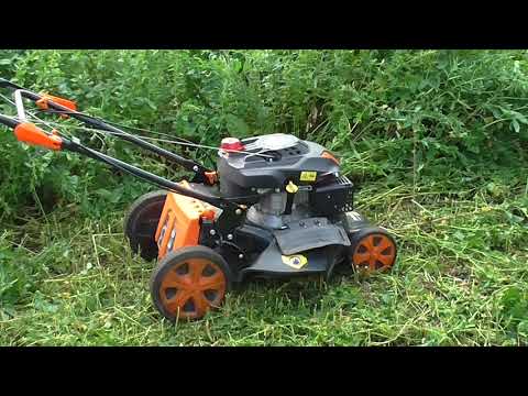 Видео: Газонокосилка берет высокую траву