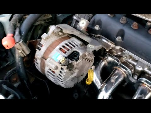 Видео: Снятие и установка генератора Nissan Altima 2.5 02-06, замена