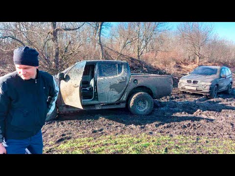 Видео: Вытянет ли Mitsubishi L200 BMW X5?  Испытание машины и резины по грязи