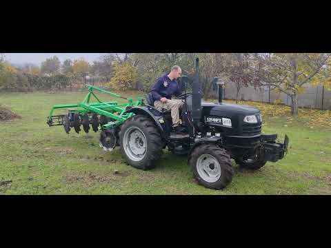Видео: Мінітрактор з дисковою бороною по влажній землі. 
