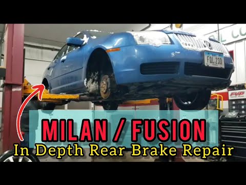 Видео: Как заменить задние тормозные колодки и диски на Ford Fusion / Mercury Milan!