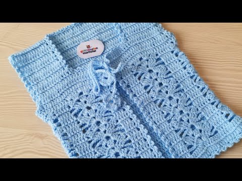 Видео: Вязаная детская жилетка-кардиган