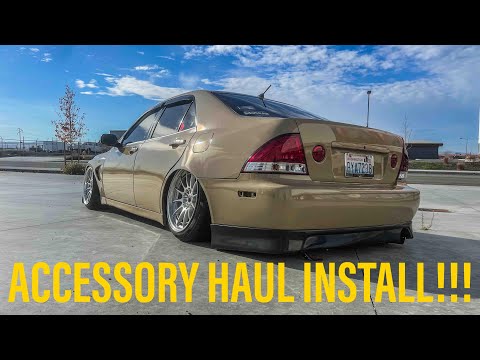 Видео: Установка модов для Lexus IS300 Mini 2001-2005 годов! Ветровики, проекторы логотипов Lexus на две...