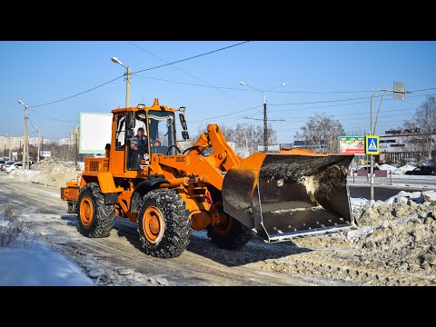 Видео: Фронтальный погрузчик Амкодор-352C. Уборка снега. / Front loader Amkodor-352C. Snow removal.