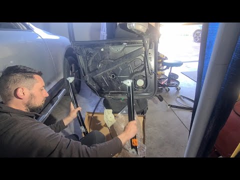 Видео: VW Touareg 7L - I replaced the broken front window regulator - установка стеклоподъемник