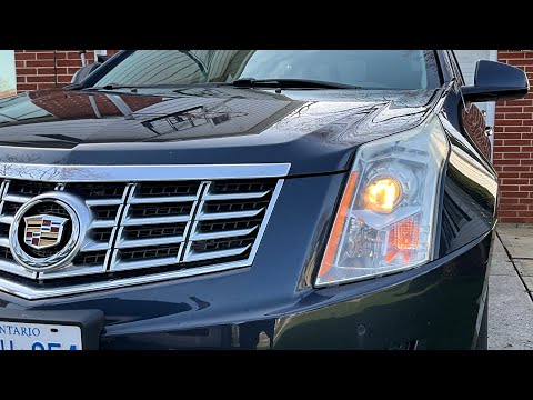 Видео: Замена лампы фары на Cadillac SRX 2016 со стороны водителя