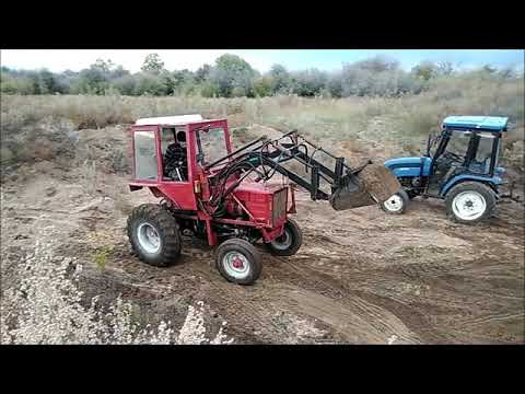 Видео: Грузим песок трактором Т-25