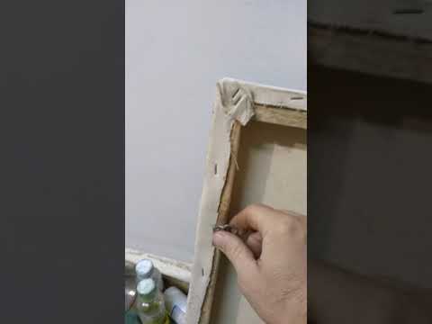 Видео: Как повесить картину на стену