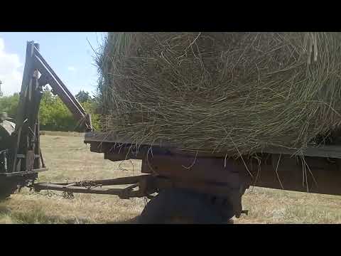 Видео: Обзор  трехосной телеги для перевозки рулонов сена, трактор т-40. 