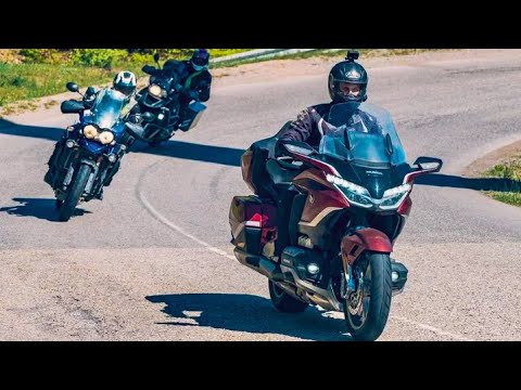 Видео: Мотоцикл С РОБОТОМ НА 7 ПЕРЕДАЧ И ПОДУШКОЙ БЕЗОПАСНОСТИ / Honda Gold Wing Tour 2021 обзор