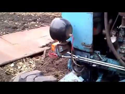 Видео: Регулировка давления в гидросистеме трактора.