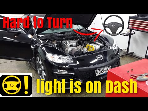 Видео: Значок рулевого колеса Mazda RX-8 на панели приборов. Рулевое колесо трудно поворачивается. Пробл...