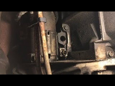 Видео: Течь масла на болтах стартера, Silverado 2500HD 2003 г.