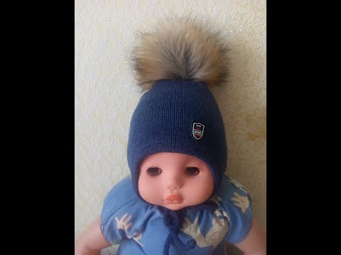Видео: Детская вязаная шапочка с ушками на однофантурной вязальной машине.
