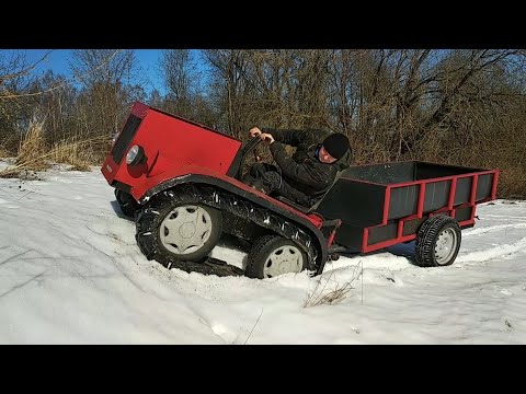 Видео: Гусеничный минитрактор по снежному  насту за водой в старый колодец который в лесу.