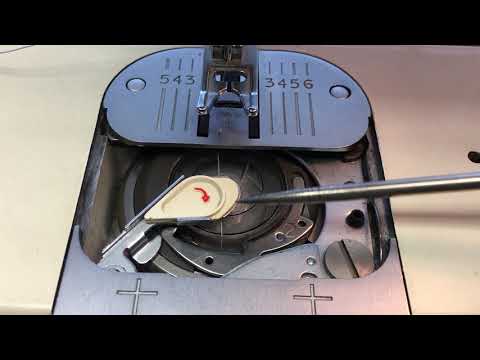 Видео: Намотка шпульки Singer Creative Touch 1036