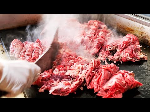 Видео: Нью-Йорк еда - Лучший стейк и сыр в Нью-Йорке! жареная свинина бутерброд