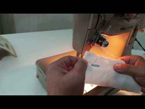 Видео: Вымётывание петли на швейной машине SINGER 401
