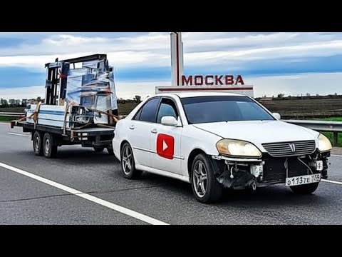 Видео: Доставка окон в Москву на Toyota Mark II с прицепом — успешная разгрузка и довольный заказчик!