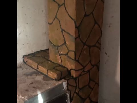 Видео: Штукатурка печи под камень.