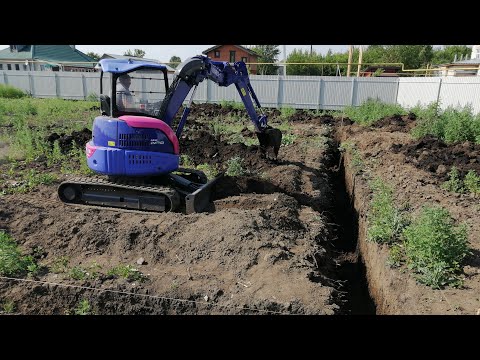 Видео: видео о том, как убирали участок и выкопали траншею под фундамент
