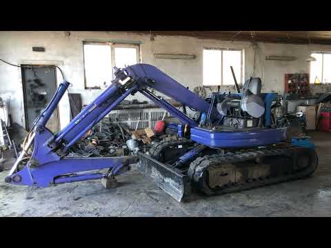 Видео: Ремонт экскаватора Коматсу PC50UU-2.Снятие стрелы. Замена втулок. Расточка разбитых проушин станины.