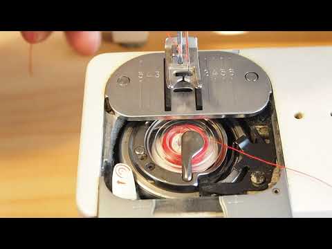 Видео: Установка намотанной шпульки — Singer серии 700 и другие швейные машины с намоткой шпульки на месте