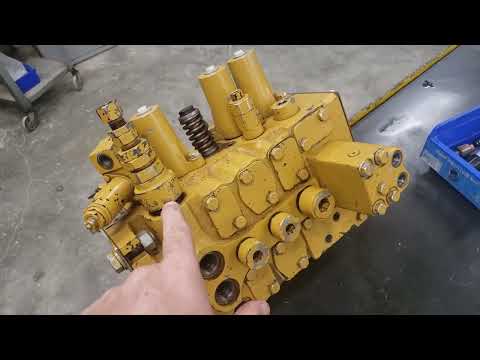 Видео: Предохранительный клапан экскаватора и главные предохранительные обратные клапаны