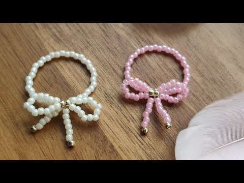Видео: Кольцо-бантик из бисера: красиво, быстро и просто!