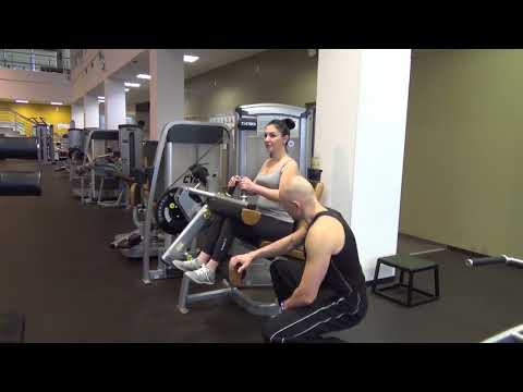 Видео: Упражнение. Сгибание ног сидя. Бицепс бедра.