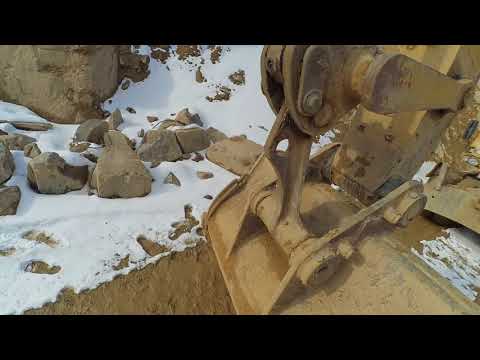 Видео: Обзор колёсного экскаватора CAT M318D