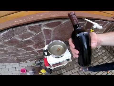 Видео: Укупорка винных бутылок корковой пробкой с термоколпачком.