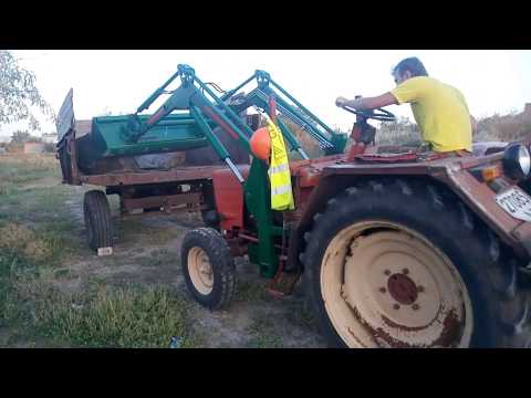 Видео: Работа фронтальным погрузчиком. Т 25.