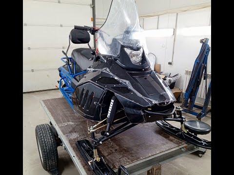 Видео: Натяжение приводной цепи на снегоходе Irbis Tungus.