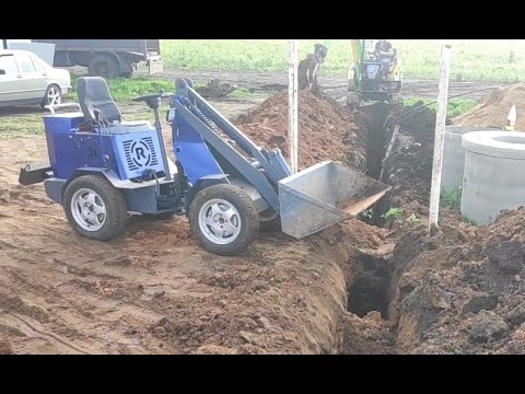 Видео: Мини погрузчик в работе.