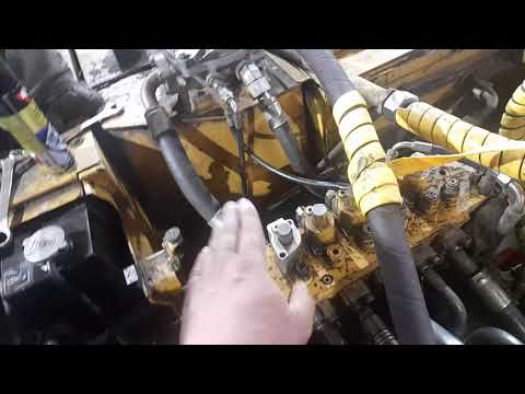 Видео: Гидрораспределитель на CAT318