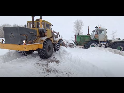 Видео: Трактор К-701. Вытаскиваю застрявший Т-150К. Пробуем делать снегозадержание.