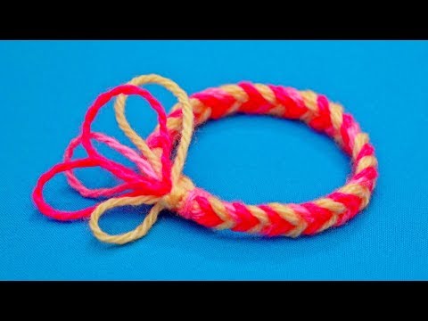 Видео: Как сплести браслет из ниток на пальцах | Плетение браслетов из ниток | Браслет из пряжи