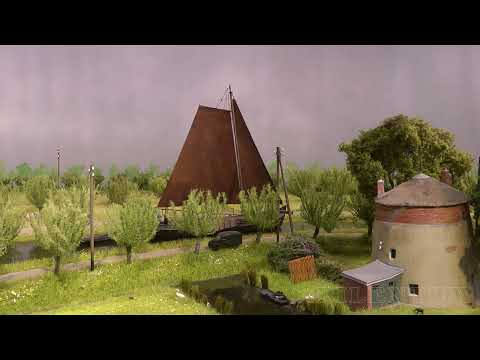 Видео: Очаровательная макет железной дороги с прекрасным пейзажем, кораблями и трамваями